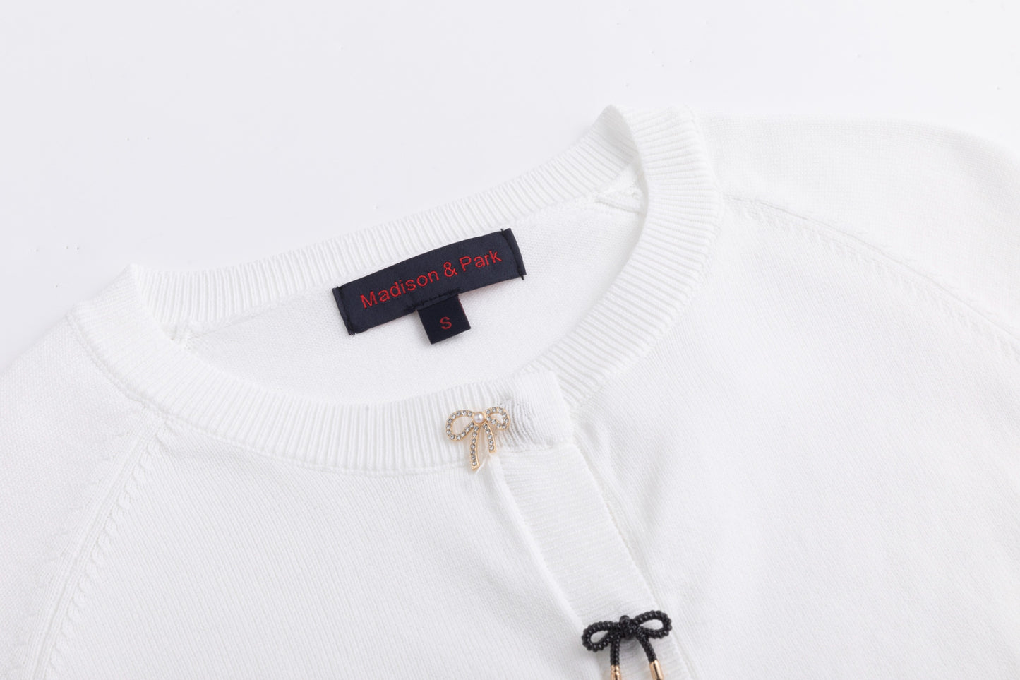 White Cardigan With Bow Shaped Buttons