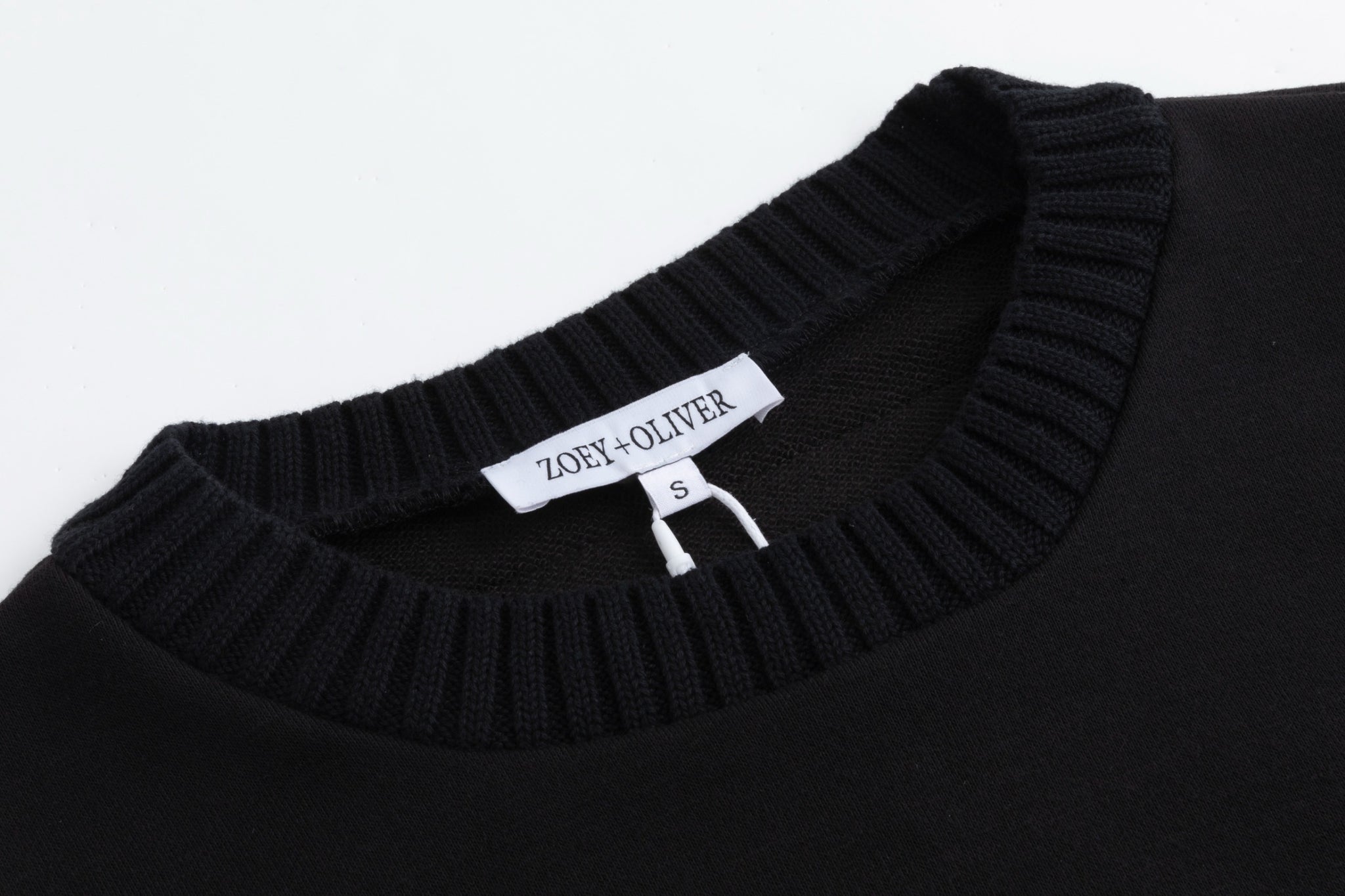 Black Sweater With Green And Blue Knit Pocket Details