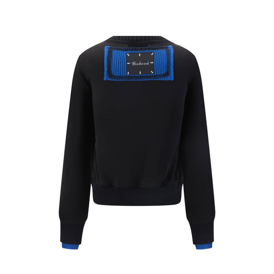 Black Sweater With Green And Blue Knit Pocket Details